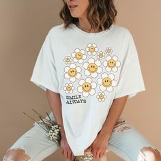 Always Smile Quote T-Shirt, Smiley Face Daisy Flower Shirt, Cute Retro Graphic Print Top, Motivational Tee, Loose Fit Oversized TShirt, Vibe This unisex Gildan 5000 heavy cotton tee is the basic staple of any wardrobe.   🤍 100% cotton  🤍 Classic fit  🤍 Tear-away label  🤍 Runs true to size Oversized Floral Print T-shirt For Spring, White T-shirt With Funny Print For Spring, Cute Oversized White T-shirt, Trendy Oversized Floral Print Tops, Cute Oversized T-shirt With Funny Print, Oversized White Floral Print Shirt, Trendy White T-shirt With Floral Print, Oversized Letter Print Shirt For Spring, Cute Oversized T-shirt For Spring