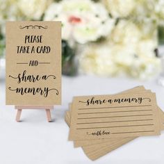 there are two cards that say please take a card and share a memory with flowers in the background