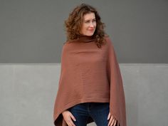 No matter how old you are you can always shine beauty everywhere you go! This brown large poncho sweater looks simply gorgeous on womens / mens of all sizes and can easily be a plus size shoulder cape / boho poncho for those bigger beautiful ladies / men's as well as a loose fit cotton gauze top that is so comfortable to wear for slim/athletic ladies / men's! Made from soft 100% cotton muslin (double gauze) fabric they are easy to take care. Find out for yourself why this handmade poncho sweater is so perfect for everyday use in the full years! We promise with these asymmetrical poncho you will draw all the attention in the crowd! -The model size is M US (38 EU) and she is 170 cm tall; -      it is one size (the best from S US (36 EU) to 5/6 XL US (52/54 EU)); -it is  brown color, but you Brown Poncho For Layering, One Size, Oversized Brown Bohemian Poncho, Oversized Brown Bohemian Cape, Cozy Brown Poncho For Layering, Oversized Brown Poncho Cape, Brown One Size Cape, One-size Brown Cape For Fall, One Size Brown Cape For Fall, Brown Long Sleeve One-size Cape