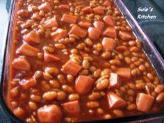 baked beans and carrots in a casserole dish ready to be eaten for lunch