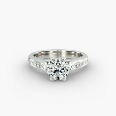 a white gold engagement ring with diamonds on the side