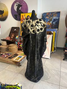 Womens new s kampala/ kaftan/ boubou dress gold and black lace patterned featuring flower embellishments.  size 12-20 uk very big and roomy inside.  The dress can be take up with wonder web if to tall. Great  dress very eye catching.  Will be steamed before the dress is sent.  This is a fair trade item from And hand made in  Nigeria.  We would like to thank you in advance for supporting are small business.  Happy shopping  Therapace Black Long Sleeve Dress In Ankara Fabric, Traditional Black Dress With Kimono Sleeves, Black Free Size Dress With Kimono Sleeves, Boubou Dress, Gold Lace Dresses, Flower Embellishments, Ankara Style, Dress Handmade, Dress Gold