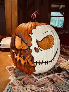 a pumpkin with a face painted on it