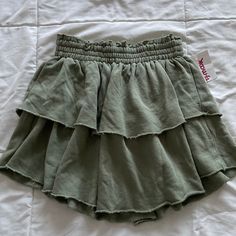 Aerie Olive Green Ruffle Flowy Tiered Athleisure Sweat Mini Skirt Size Xs Tiktok Viral New With Tags/ Never Worn Went Viral On Tiktok Last Year Two Layers Of Ruffles Stretchy, Elastic Waistband Cotton Material With Terrycloth Inside See Photos For Approximate Measurements Waistband Is Very Stretchy And Can Stretch More Than The Measurement In The Photo Skirt Is Also Available In Light Gray In This Size On My Page! Workout, Exercise, Fitness, Athletic, Athletic Wear, Active, Activewear, Gym, Spor Green Ruffle Skirt, Casual Green Ruffled Bottoms, Casual Green Pleated Skirt, Casual Stretch Ruffled Skirt Bottoms, Casual Stretch Skirt With Ruffles, Casual Ruffled Stretch Skirt, Green Casual Skirt With Ruffles, Casual Green Ruffled Skirt, Casual Green Skirt With Ruffles