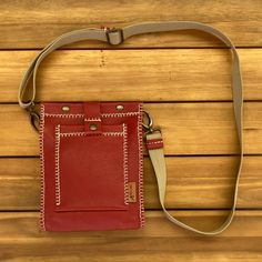 "Small red leather shoulder bag, made entirely by hand. It's a small messenger-type bag. It measures only 9.4 x 7.9 x 2\", but it fits all the essentials (wallet, smartphone, glasses, keys...). It has two pockets, one inside for the cellular phone and the other external closed with a push button. It is made with top quality bovine leather and hand sewn with waxed thread with the unmistakable Pielroja style. The result is a handy bag, original and stylish, a shoulder bag ideal for women optimistic and daring, but if you do not like the red color, you have it available in other colors. And if you find it small, there is another bigger model, there are bags for all tastes! https://www.etsy.com/es/shop/Pielroja?section_id=23139989 SHIPPING AND RETURNS The order will be ready in 5-10 days. The Red Leather Phone Shoulder Bag, Handmade Red Crossbody Shoulder Bag, Neck Wallet, Red Leather Shoulder Bag With Turn-lock Closure, Compact Red Leather Wallet, Daily Red Bag With Silver-tone Hardware, Cellular Phone, Safe Travel, Messenger Bags