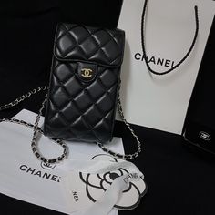 Exquisite Genuine Leather: The Chanel Crossbody Phone Bag is crafted from luxurious genuine leather, offering a refined texture and lasting durability. This high-quality material elevates the bags elegance while ensuring it withstands everyday use. Timeless Chanel Aesthetic: Embodying Chanel's classic design philosophy, this tote bag features the iconic quilting pattern and subtle yet distinctive logo. The timeless aesthetic makes it a versatile accessory, perfect for both casual and formal s... Chanel Plaid, Crossbody Phone Purse, Chanel Crossbody, Luxury Phone Case, Phone Purse, Phone Pouch, Quilted Bag, Shoulder Purse, Vintage Handbags