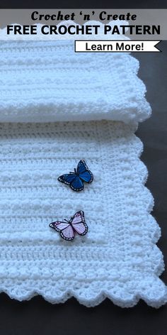 two crochet butterflies sitting on top of a white blanket with text overlay that reads, crochet in create free crochet pattern learn more