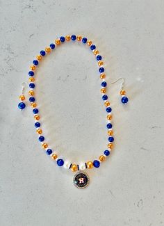 Beaded orange and Blue necklace with Earrings.  Great gift for Astros fans, Baseball game, Baseball lover, Dinner party, Girls night, Birthday parties, matching your outfit, Stylish and cute. Beaded Orange, Party Girls Night, Baseball Jewelry, Orange Jewelry, Fan Jewelry, Baseball Gifts, Jewelry Beaded, Jewelry Blue, Baseball Game