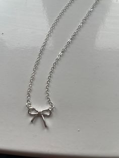 A beautiful bow necklace on an 41cm fine curb sterling silver chain very cute and dainty necklace bow 1cm x 1cm Cheap Silver Necklaces, Cute Jewelry Necklaces Silver, Cute Silver Accessories, Jewellery Silver Necklace, Dainty Silver Necklaces, Cute Silver Necklace, Sterling Silver Necklace With Delicate Chain For Party, Adjustable Sterling Silver Party Necklace, Adjustable Sterling Silver Necklaces For Party