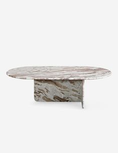 an oval marble table with metal legs and a white base, against a gray background