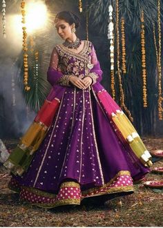 a woman in a purple and yellow wedding gown