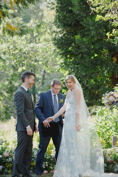 the bride and groom are getting ready to walk down the aisle at their outdoor wedding ceremony