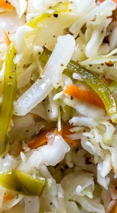 the cabbage salad has carrots, celery, and onions on it's side