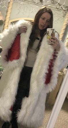 "Here is the coat inspired by the one Cruella wore in Once Upon a Time. It is made of white faux fur (black also for the dog tails), lined with red, and includes the attached drape in the back with the four \"dog tails.\" The drape is NOT detachable. This coat is big and heavy. It is meant to be worn both on and off the shoulders. This is the coat only. I do not have the dress available at this time. Please send your bust, waist, hips, and shoulder to floor for measurements. It is custom made, b White Faux Fur Outerwear With Feather Trim, White Faux Fur Party Outerwear, White Faux Fur Outerwear For Party, Winter Costume Outerwear With Faux Fur Lining, White Long Sleeve Outerwear For Costume Party, White Long Coat With Faux Fur Lining, White Faux Fur Coat, White Faux Fur, Women's Costumes