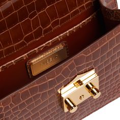 A signature Rubeus jewelled treasure that testifies to the power of classical elegance and Italian artistry. Born as the perfect Christmas present, the Flash Natale dominates all the year around. Small Natale Bag in cognac shining crocodile with gold-tone hardware and detachable crocodile strap. Interior slip pocket Measurements : 20x15x5.5 cm Made in Italy The Perfect Christmas, Crocodile Leather, Christmas Present, Shopper Bag, High Jewelry, The Flash, Jewelry Bags, Perfect Christmas, Cognac