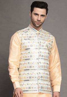 Art Silk Nehru Jacket in Light BeigeThis Readymade Sleeveless attire is Enhanced with Buttons, Mirror Effect and Resham Work. Crafted in Chinese Collar NeckDo note: Brooch and Kurta shown in the image is for presentation purposes only. Half to one inch may vary in measurement. (Slight variation in actual color vs. image is possible) Mens Kurta | Mens Kurta Pajama | Mens Sherwani | Mens Sherwani Sets | Traditional Menswear | Partywear Menswear | Indian Mens Dresses | Diwali Kurta | Kurta Pajama | Spring Chanderi Nehru Jacket With Resham Embroidery, Spring Resham Embroidery Chanderi Nehru Jacket, Spring Nehru Jacket With Resham Embroidery In Chanderi, Designer Multicolor Nehru Jacket With Chikankari Embroidery, Sleeveless Nehru Jacket With Zari Work For Transitional Season, Spring Embroidered Chanderi Sherwani, Spring Wedding Nehru Jacket In Chanderi, Bollywood Style Floral Embroidered Chanderi Nehru Jacket, Bollywood Style Nehru Jacket With Floral Embroidery For Diwali