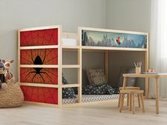 a child's room with bunk beds and spider - man artwork on the wall