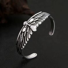 Vintage Fashion Stainless Steel Eagle Wings Bracelet Discover the perfect accessory for expressing your unique style with our Vintage Fashion Stainless Steel Eagle Wings Bracelet. This trendy charm bracelet is designed for both men and women, making it a versatile addition to any jewelry collection. Specifications Gender: Unisex Metals Type: Stainless Steel Fine or Fashion: Fashion Style: Punk Material: Metal Shape/Pattern: Cross Detail Packing: Jewelry Bag Metal: 316L Stainless Steel Durability Adjustable Stainless Steel Punk Bracelets, Silver Punk Wristband As Gift, Silver Punk Style Wristband Gift, Punk Metal Wristband As Gift, Adjustable Alloy Bangle Bracelet, Punk Style Bangle Bracelets As Gifts, Punk Style Bangle Bracelets For Gifts, Silver Punk Bangle Bracelet, Vintage Silver Wristband As Gift