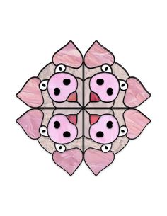 a pink pig face is shown in the center of a flower shaped glass window frame