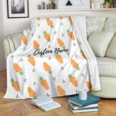 a couch covered in a blanket with carrots on it and the name customize