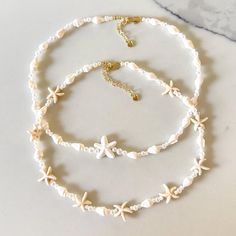 Starfish and Conch shells Choker Necklace, Natural shells Jewelry, Beach Necklace, Summer Shell Necklaces Necklace Length - 15" + 2 inch extension chain (approximately 17 inches in total) Need a custom length? DM us! 😊✨ These handmade  natural shells choker necklaces are the perfect gift for her--whether you're searching for a unique gift for a bride, a gift for mom, or a bridal shower gift or engagement gift. Each piece is carefully crafted by hand, making it a one-of-a-kind keepsake that she' Poocashell Necklace, Cute Beachy Necklaces, Cruise Jewelry, Shells Jewelry, Shell Accessories, Sea Shell Necklace, Beach Jewellery, Conch Shells, Gift For A Bride