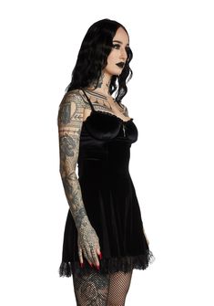 will have them under the illusion of devotion. You're like a prayer in this impure velvet mini dress that has sinful lace trim, underwire support, a deathly devoted cross design and back zip closure. Gothic Mini Dress With Lace Trim For Night Out, Gothic Underbust Dress For Night Out, Gothic Lace Trim Mini Dress For Halloween, Halloween Gothic Mini Dress With Lace Trim, Gothic Halloween Mini Dress With Lace Trim, Fitted Gothic Velvet Mini Dress, Black Velvet Gothic Mini Dress, Gothic Mini Dress With Corset Back, Gothic Velvet Dress For Costume Party