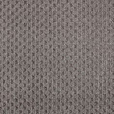 an up close shot of the textured surface of a carpeting material, with dark grey and light gray tones