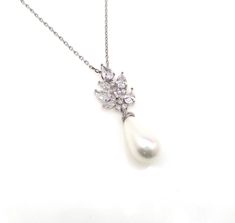 White teardrop high-quality light cream or white shell pearl drop pendant with rhodium silver plated brass multishape cubic deco cluster connector. comes with 16 or 18 inch sterling silver chain Size of pendant including bail : 4cm x 1.3cm Matching earrings and bracelet available.... https://www.etsy.com/listing/293328509/bridal-earrings-wedding-jewelry-platinum?ref=listings_manager_grid https://www.etsy.com/listing/255812223/bridal-earrings-wedding-jewelry-platinum?ref=listings_manager_grid htt Pearl White Teardrop Cubic Zirconia Jewelry, Fine Jewelry Teardrop Pendant Bridal Necklace, Teardrop Pearl Pendant Jewelry With Cubic Zirconia, Teardrop Cubic Zirconia Pearl Pendant Jewelry, Fine Jewelry Bridal Necklace With Teardrop Pendant For Wedding, Teardrop Pearl Pendant With Cubic Zirconia, White Pearl Drop Bridal Necklace With Cubic Zirconia, White Cubic Zirconia Bridal Necklace With Pearl Drop, Pear-shaped Pearl Pendant Jewelry With Cubic Zirconia