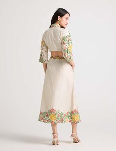 Dress with distinction in this ivory chanderi button-down skirt, adorned with exquisite floral threadwork, delicate beadwork, and charming checkered cutwork. This piece exudes elegance and charm, offering a refined addition to your wardrobe. Cutwork Top, International Style, Top And Skirt, Cut Work, Bead Work, Dress Skirt, Women Wear, Skirt, Wardrobe