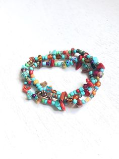 Wrap Handmade colorful Beads Bracelet, Bracelet for teenagers, Bobo Hippie Bracelet, Gifts for her, One of a kind Bracelet. Eclectic bracelet handmade with colorful gemstone, turquoise, red coral, copper findings and glass beads. light and comfortable to wear, avoid water and perfume. Wraps 3 times around 6 to 7 inches wrist. Free shipping with USPS mail, packed and protected in a gift box. Turquoise Wrap Bracelet Gift, Multicolor Multi-strand Friendship Bracelets For Beach, Turquoise Multi-strand Wrap Bracelet As Gift, Turquoise Hand-wrapped Hippie Beaded Bracelets, Turquoise Wrap Bracelet Great For Gifts, Festival Hand Wrapped Wrap Bracelet, Hippie Beaded Wrap Bracelet With Round Beads, Bohemian Red Bracelet With 108 Beads, Spiritual Multicolor Adjustable Wrap Bracelet