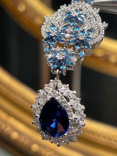 Hand made, one of a kind Art Deco style AAAA grade lab sapphire pear shape cz  hand set in 925 Sterling silver laser white gold plated. Luxury Diamond Jewelry, Art Hippie, Cowry Shell, Beautiful Tiaras, Feather Fan, Cz Necklace, Yellow Earrings, Expensive Jewelry, Hot Nails