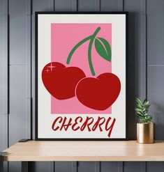 two cherries on a pink background with the word cherry in red font below them