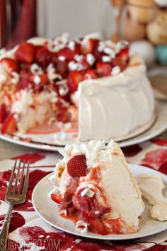 two plates with slices of strawberry shortcake on them