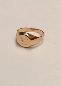 "Pinky ring, Engraved ring, Initial Ring, Personalized Ring Engraved Signet ring with Round Seal- Best quality 18k Gold Plate Engraved 1 letter - Vintage style Diameter: 0.7 mm = 0.27\" Please note in the \"notes to seller\" at checkout. : * state your ring size * letter you want to apper The product will arrive to you packed in gift box and padded envelope to maintain the product Our jewelry are water resistant and comes with 1 year warranty Thank you for your interest. Please check out our oth Vintage Engraved Ring With Initials For Promise, Vintage Engraved Promise Ring With Initials, Vintage Engraved Initials Promise Ring, Vintage Initials Signet Ring, Elegant Rings With Initials On Round Band, Elegant Ring With Initials On Round Band, Elegant Open Ring With Engraving Option, Timeless Formal Rings With Initials, Formal Timeless Initials Rings