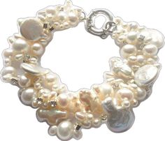 a white bracelet with pearls on it