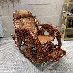 a wicker rocking chair sitting on top of a carpeted floor next to a wall