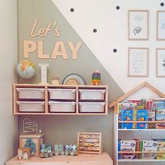 a child's playroom with toys and bookshelves on the wall next to it