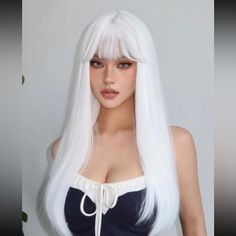 a woman with long white hair wearing a wig