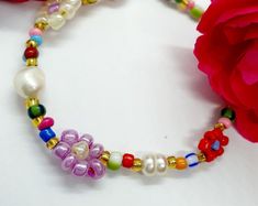 Colourful Beaded Daisy Bracelet/pearl and Beads Bracelet/pearl | Etsy Gift Multicolor Pearl Bracelet With Spacer Beads, Bohemian Multicolor Beaded Bracelets With Flower Charm, Multicolor Pearl Bracelet With Spacer Beads As A Gift, Handmade Colorful Flower Shaped Bracelets, Handmade Colorful Flower Bracelets, Elegant Multicolor Flower Beaded Bracelets, Multicolor Beaded Pearl Bracelet Gift, Handmade Multicolor Pearl Beaded Bracelets, Multicolor Beaded Pearl Bracelet As A Gift