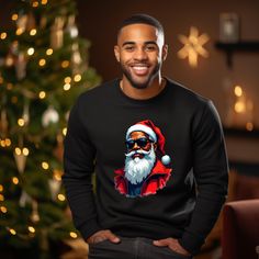 Black Santa Christmas Shirt, African American Santa Shirts , Santa Claus, Melanin Christmas Shirts, Unisex, Christmas Sweatshirts  Brand Information  Adult Sized, Unisex  100% Cotton Bella Canvas - Short Sleeve and Long Sleeve. 50% Cotton 50% Polyester Gildan Sweatshirts PLEASE READ INSTRUCTIONS CAREFULLY -----How To Order----- 1- Choose your t-shirt sleeve length, size, and color *PLEASE NOTE: THE DROP DOWN BOX HAS SHORT SLEEVE, LONG, SLEEVE AND SWEATSHIRT AVAILABLE. YOU MUST SELECT THE DESIRED SHIRT - SHORT SLEEVE, LONG SLEEVE OR SWEATSHIRT* 2-Choose your t-shirt size and color combination 3- Click add to cart. You can go back to add more product 4-Click "View in Cart" to Check out. -----CARE INSTRUCTIONS----- Wash item inside out in cold water, do not bleach, do not dry clean, do not ir Black Shirt For Winter Holiday, Christmas Crew Neck Shirt Gift, Christmas Gift Crew Neck Shirt, Black Long Sleeve Holiday Shirt, Black Crew Neck Shirt For Christmas, Long Sleeve Christmas Holiday Shirt, Black Long Sleeve Christmas Shirt, Holiday Long Sleeve Tops As Gifts, Holiday Long Sleeve Tops As A Gift