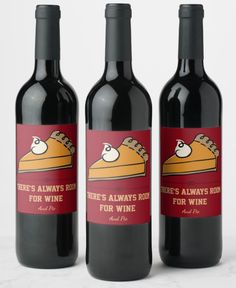 three bottles of wine with labels on them