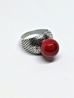 "Natural Italian Red Coral Silver Engraved with Hearts Ring, size 8.5 Red Coral Silver Ring, size 8.5, stone dimension 12mm (0.48\")  Impeccable quality - the best gift for the women! If you buy our jewelry with natural gems, you will become the owner of a unique thing. Materials: 925 sterling silver over neizilber (new silver), red coral gemstone I have also matched earrings for the ring (see picture 10) About coral: Coral is of organic origin. Coral can be used to reconnect with nature and its variety of wonders. Coral also attracts love and prosperity, creativity and optimism. Emotionally, coral brings inner peace, strength, and understanding of purpose.   All my jewelry comes in a nice box, ready to make your gift (to yourself or somebody else).  If you need a special gift note address Red Adjustable Heart Ring For Valentine's Day, Adjustable Red Heart Ring For Valentine's Day, Adjustable Red Heart Ring As Gift, Serpentine Stone, Reconnect With Nature, Coral Gemstone, Engraved Ring, Red Band, Dangly Earrings