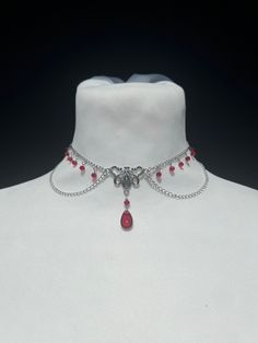 Succumb to the charm of this necklace combining Victorian style and art nouveau, adorned with a drop of blood pearl and delicate faceted pearls, inspired by the elegance of vampire legends. --------------------------- Chain 2 x 3 mm in stainless steel Glass drop bead 15 x 8 mm Small red faceted glass beads 3 mm Zinc alloy clasps and connectors Minimum length: 29 cm* Maximum length: 39 cm* ⚠ All my jewelry is assembled by hand Jewelry resistant to time provided you take care of it, avoid contact Vampire Legends, Vampire Necklace, Red Beaded Necklace, Pearl Art, Butterfly Fashion, Red Beaded Necklaces, Diy Jewelry Projects, Art Nouveau Style, Fancy Jewellery