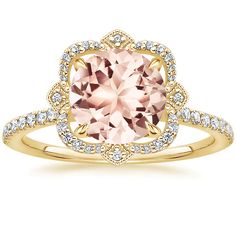 an 18k rose gold ring set with a cushion cut morganite surrounded by diamonds