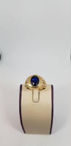 "Vintage 14K Yellow Gold CZ Ring, Size 10. Stamped 14K twice inside band. Blue stone is 10 x 8mm. Weighs 5.4 dwt. Please stop in often as we will be adding additional vintage fine jewelry beauties. Note that the letter/number combo in the title is for our purposes only. We do not check prongs for wear or stones for looseness. All items are sold as is-noting that we are a resale shop so everything here had a previous owner! We will include flaws in the description when noted. This is one of the r Formal Oval Sapphire Signet Ring, Formal Sapphire Oval Signet Ring, Oval Sapphire Signet Ring In 14k Gold, Classic Sapphire Ring Stamped 14k, Oval Sapphire Ring Stamped 14k For Formal Occasions, Formal Oval Sapphire Ring Stamped 14k, Classic Formal Signet Ring With Accent Stones, Formal Sapphire Signet Ring With Gemstone, Formal Sapphire Gemstone Signet Ring