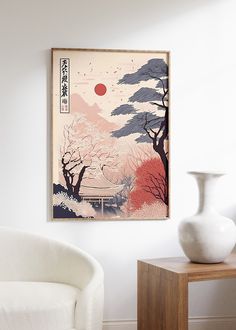 a white chair sitting next to a vase on top of a wooden table in front of a wall