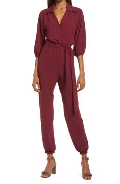 The jumpsuit trend is, well, hopping, and this option, styled with an easy tied waist and elastic cuffs, is a winning way to wear the look. 58" length; 30" inseam; 10" leg opening (size Medium) Front button-and-loop closure Surplice V-neck with spread collar Long sleeves Elastic cuffs and waist Front slant pockets Removable tie belt Partially lined 100% polyester Hand wash, line dry Made in the USA Women's Clothing Wedding Guest Jumpsuits, How To Style Jumpsuit, Jumpsuit For Wedding Guest, Coverall Jumpsuit, Formal Jumpsuit, Wedding Jumpsuit, Jumpsuit Dressy, Diy Fashion Clothing, Long Sleeve Jumpsuit