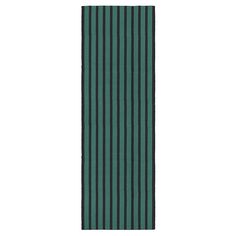 a green and black striped rug on a white background