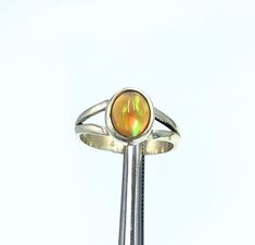 Ethopian Opal Ring, Natural Opal, Opal Jewellry, Handmade Ring, Sterling Silver 925, Opal Gemstone, Gemstone Jewellry Gemstone : Opal Material, Silver 925  Weight : 18.30 CT Origin : Made in Ethopia Size: 2.1 CM , 21 mm Handmade item Materials: silver 925 Gemstone: Opal Band color: white Opal is a hydrated amorphous form of silica; its water content may range from 3 to 21% by weight, but is usually between 6 and 10%. Due to its amorphous property, it is classified as a mineraloid, unlike crystal Opal Band, Opal Ring, Natural Opal, White Opal, Ring Sterling Silver, Opal Gemstone, Electronic Items, Opal Rings, Handmade Ring