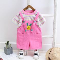 2-piece Colorful Striped T-shirt & Dungarees for Toddler Girl Wholesale children's clothing - PrettyKid Playful Short Sleeve Spring Sets, Playful Short Sleeve Sets For Spring, Casual Summer School Sets, Cute Pink Sets With Short Sleeves, Playful Pink Short Sleeve Sets, Cute Spring School Sets, Cute School Sets For Spring, Pink Cotton Sets For Summer, Pink Summer School Sets